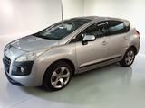 a picture of a silver car parked in a garage