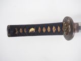 an image of a close up of a sword on a white surface