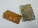 two soap bars sitting next to each other on a white surface