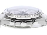 a close up of a watch on a white surface