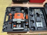 an orange and black electric drill in a case on a table