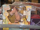 a toy dog that is sitting on a shelf