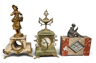 several different types of clocks and figurines are displayed on a white surface
