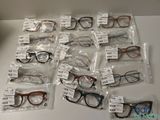 many pairs of glasses on the table with price tags on them