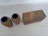 two vases sitting next to each other on a table