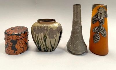 three different vases sitting next to each other on a table