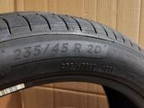 a close up of a tire on a cardboard box with a cardboard box in the background