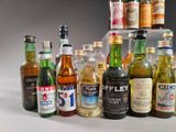 many bottles of alcohol lined up on a table