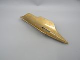 an image of a gold colored metal object on a white surface