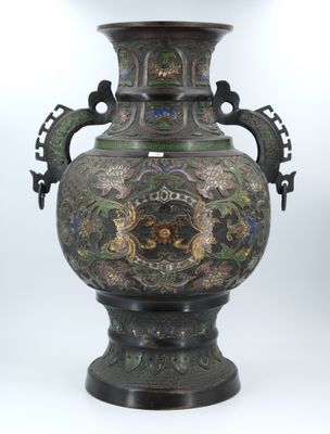 a large vase with a dragon design on it