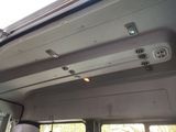 a view of the inside of a bus with the sun shining through the window
