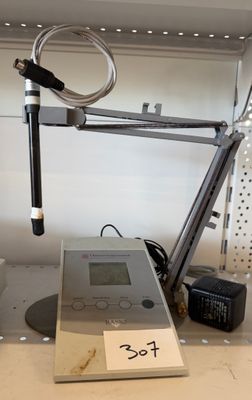 an image of a table with a clock and a radio