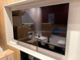 a flat screen tv mounted on a wall in a living room