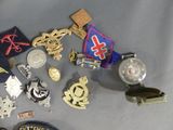 a lot of badges and other items that are on a table