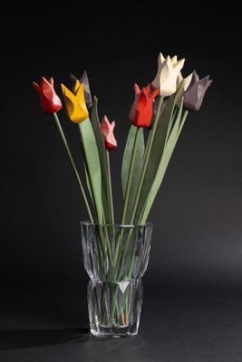 a glass vase with a bunch of flowers in it