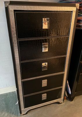 black metal filing cabinet with five drawers in a room