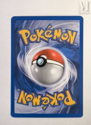 a close up of a pokemon card on a white surface