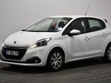 a white car parked in a room with a black floor