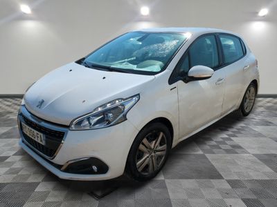 the small white car is parked in the room on a checkered floor