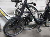 two bikes that are parked next to each other