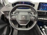 the interior of a car with a steering wheel and dashboard controls
