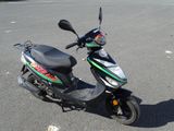 a scooter that is parked in a parking lot