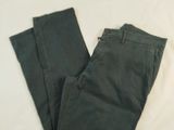 a pair of pants that are laying on a bed