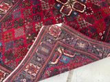 a rug on the floor with a cat laying on it