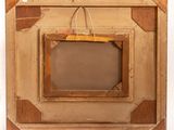 a picture of a wooden frame with a picture hanging on it