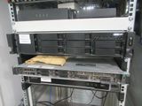 a rack with a bunch of computers on top of it
