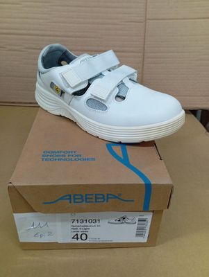 an image of a pair of white shoes sitting on top of a box