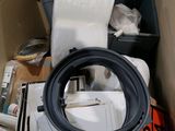 an image of a toilet in a box full of stuff