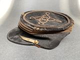 a small black purse sitting on top of a table