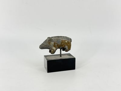 a close up of a sculpture of a bear on a stand
