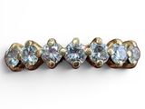 an image of a close up of a ring with three stones
