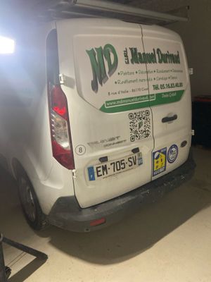 a van that is parked in a garage with its door open