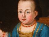 portrait of a child in a blue dress holding a glass of wine