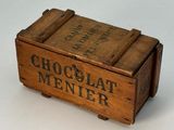 wooden box with chocolate menner written on it on a white surface