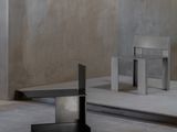 two benches and a table in a room