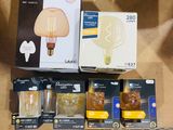 many different types of light bulbs on display in a store