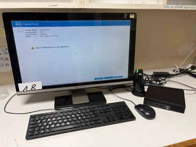 a desktop computer sitting on a desk with a keyboard and mouse