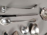 many spoons and spoon spoons laid out on a table