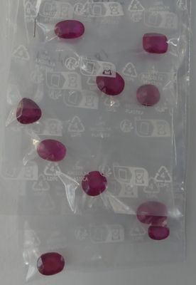 a plastic bag filled with red and white candies