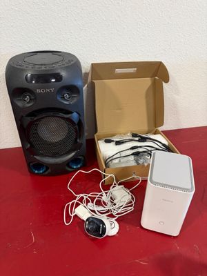 two speakers and a speaker box on a red table