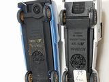 two cell phones sitting next to each other on a table