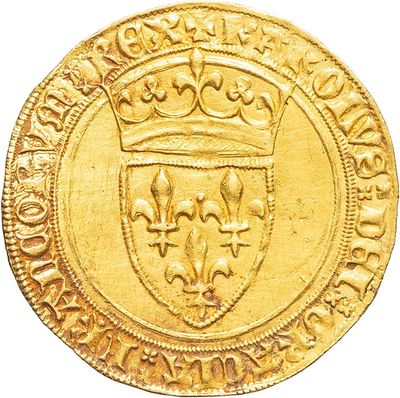 a close up of a gold coin with a crown on it
