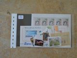 un morceau de papier avec des timbres dessus, posé par terre