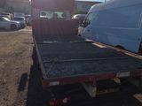a white van that is sitting in the back of a truck