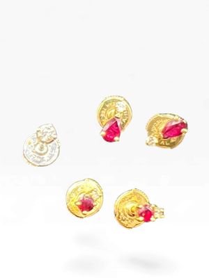 three pairs of gold earrings with pink stones on a white surface