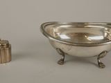 an image of a silver bowl and a small silver container